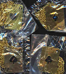 #BEADS0373 - Group of Four Gold Colored Tin Playing Card Shaped Necklaces - Aces of Spades, Clubs, Hearts, Diamonds