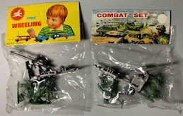 #TY869 - Pair of Toy Combat Sets in Original Pa...