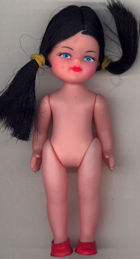 #TY541 - Poseable Dimestore Doll with Rubber Banded Hair Still in Cellophane Package