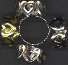 #TY447 - Group of 10 Tin Linked Hearts Adjustable Size Dimestore Rings