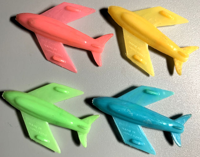 Group of 4 Different Colored Toy Airplane Whistles